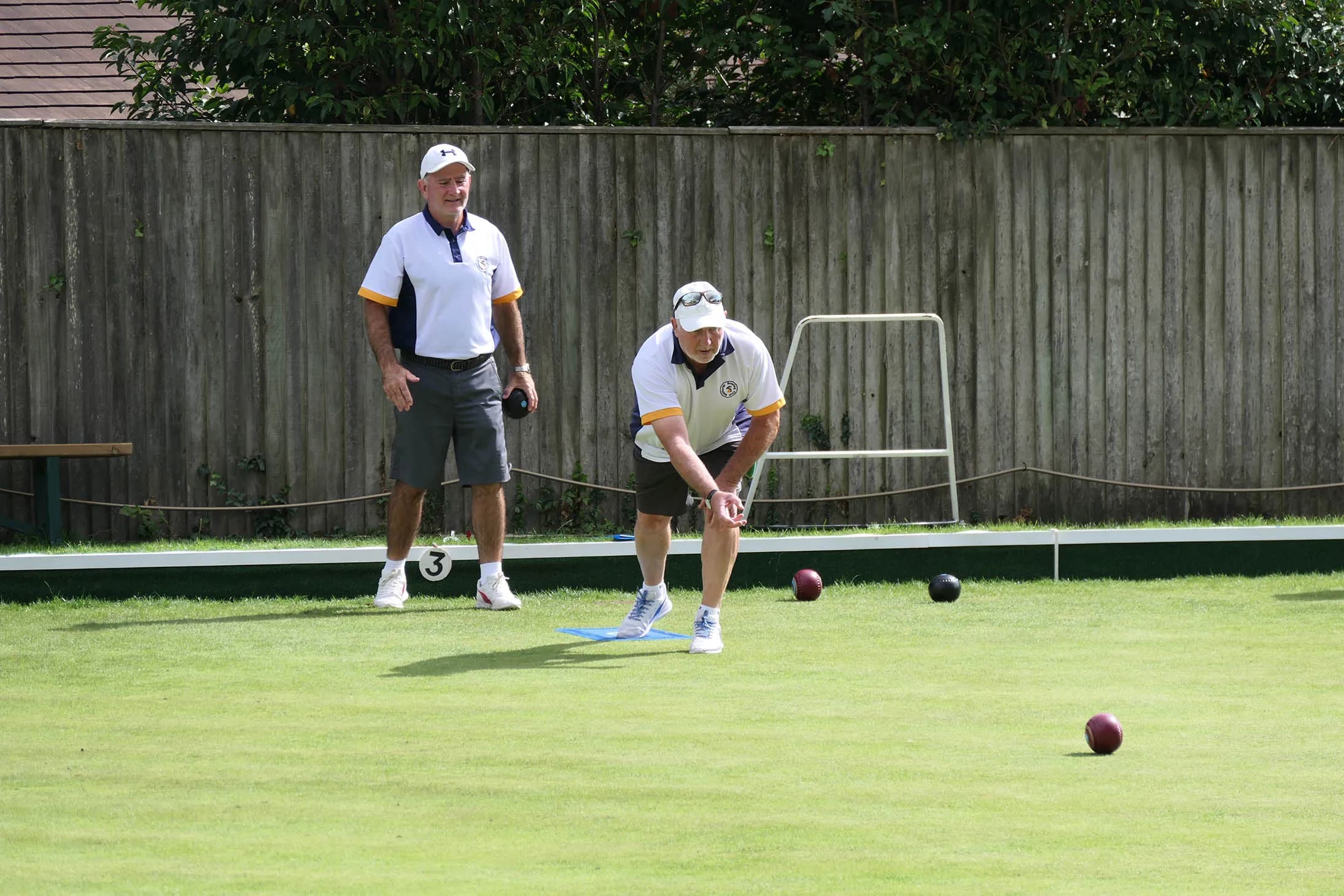 A Midhurst member delivering a bowl on the club's green